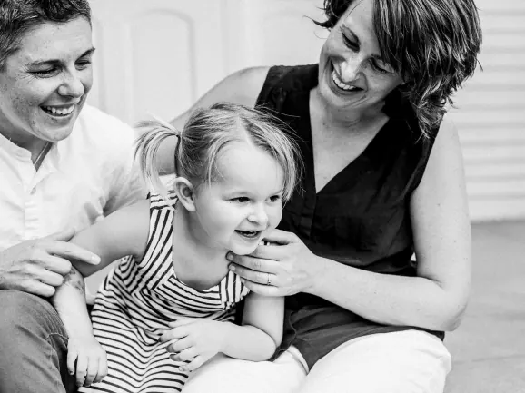 Dr. Jyme Charette and Stacie Steinbock, who founded the practice together, with their daughter.